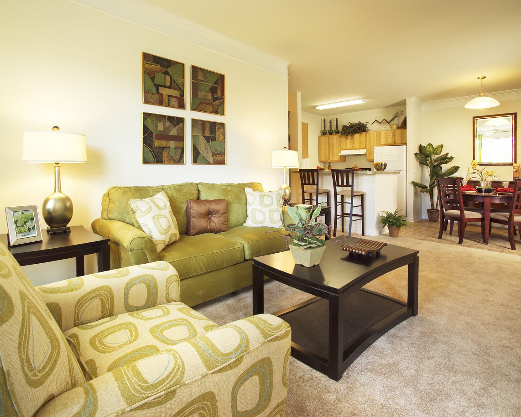 A decorated living room and dining table at the Magnolia Pointe Apartment Homes in Durham, North Carolina.